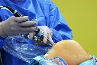 Surgical team performing a minimally invasive procedure