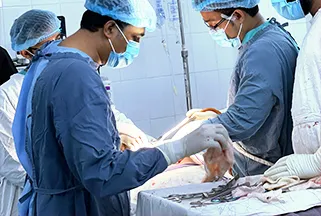 Healthcare professionals working in an operating theatre